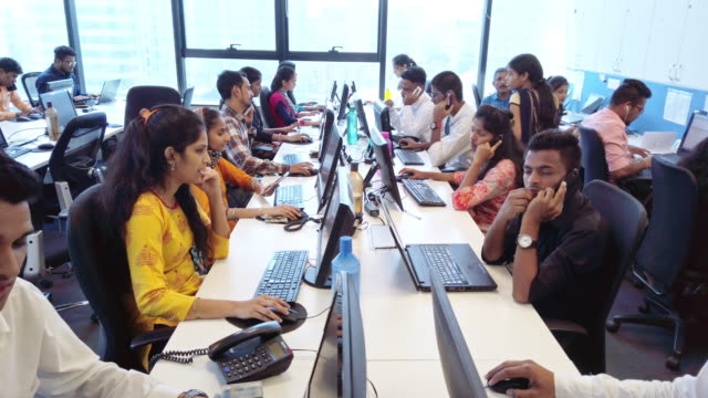 Corporate Business, Indian, Office - Group of Customer Service Executives Attending Calls at a Busy Call Centre
